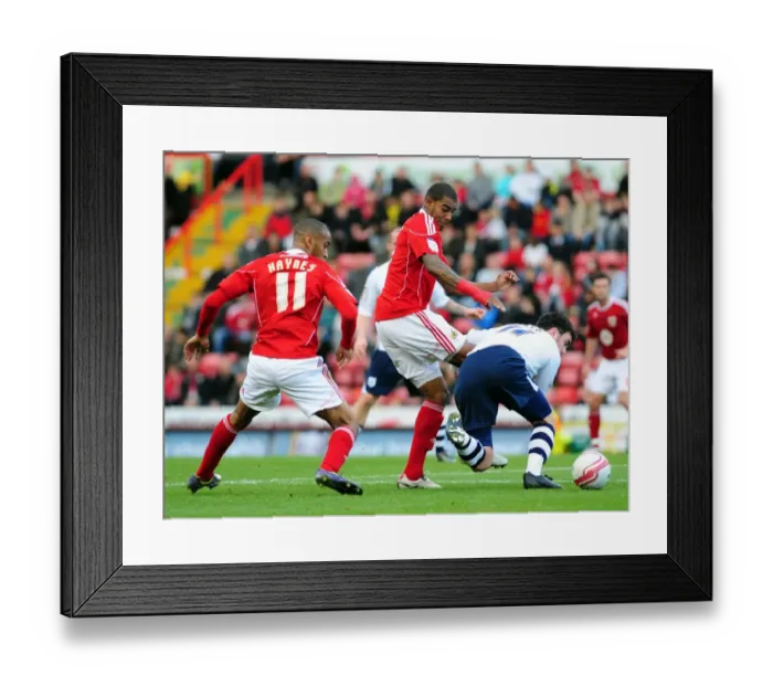 Framed Print : Battling for Supremacy: Marvin Elliott vs. Keith Treacy in the Championship Clash between Bristol City and Preston North End Framed Print : Battling for Supremacy: Marvin Elliott vs. Keith Treacy in the Championship Clash between Bristol City and Preston North End