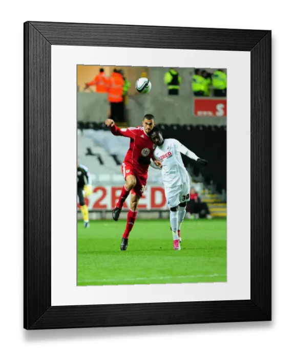 Framed Print : Battling for Supremacy: Caulker vs. Emnes in the Championship Clash between Swansea City and Bristol City (10 / 11 / 2010) Framed Print : Battling for Supremacy: Caulker vs. Emnes in the Championship Clash between Swansea City and Bristol City (10 / 11 / 2010)