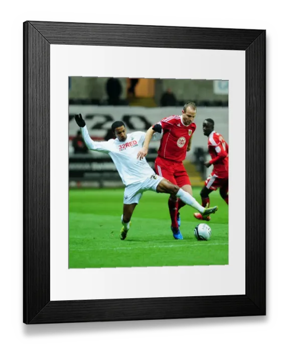 Framed Print : Battling for Supremacy: Louis Carey vs. Scott Sinclair in Swansea City vs. Bristol City Championship Clash (10 / 11 / 2010) Framed Print : Battling for Supremacy: Louis Carey vs. Scott Sinclair in Swansea City vs. Bristol City Championship Clash (10 / 11 / 2010)