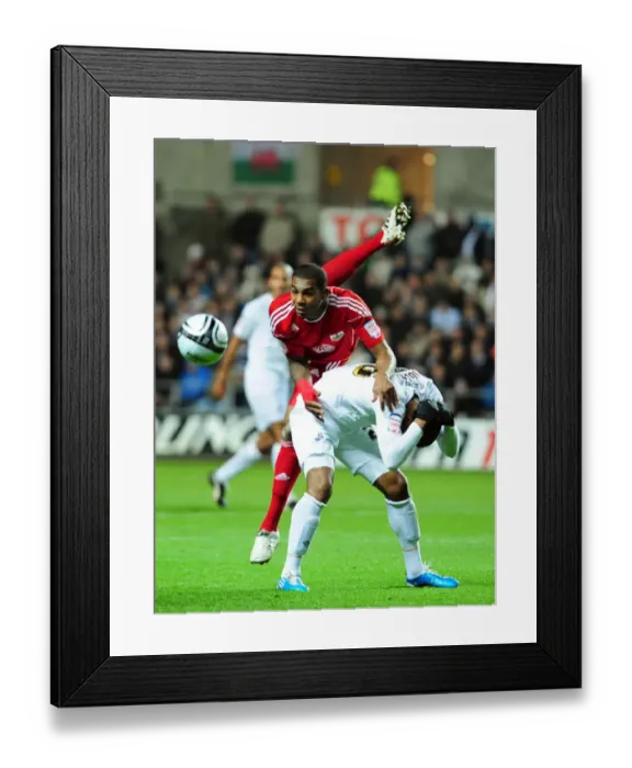 Framed Print : Battling for Championship Supremacy: Marvin Elliott vs. Kemy Agustien, Swansea City vs. Bristol City, 10 / 11 / 2010 Framed Print : Battling for Championship Supremacy: Marvin Elliott vs. Kemy Agustien, Swansea City vs. Bristol City, 10 / 11 / 2010