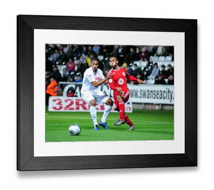 Framed Print : Battling for Supremacy: Haynes vs. Williams in Swansea City vs. Bristol City Championship Clash (10 / 11 / 2010)