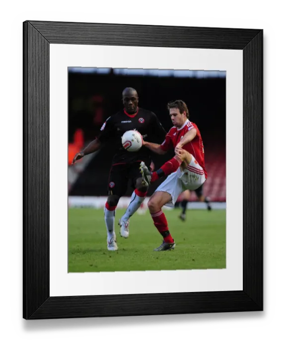 Framed Print : Brett Pitman Soars Over Nyal Bell-Noseworth: A Pivotal Moment in the 2010 Bristol City vs. Sheffield United Championship Clash