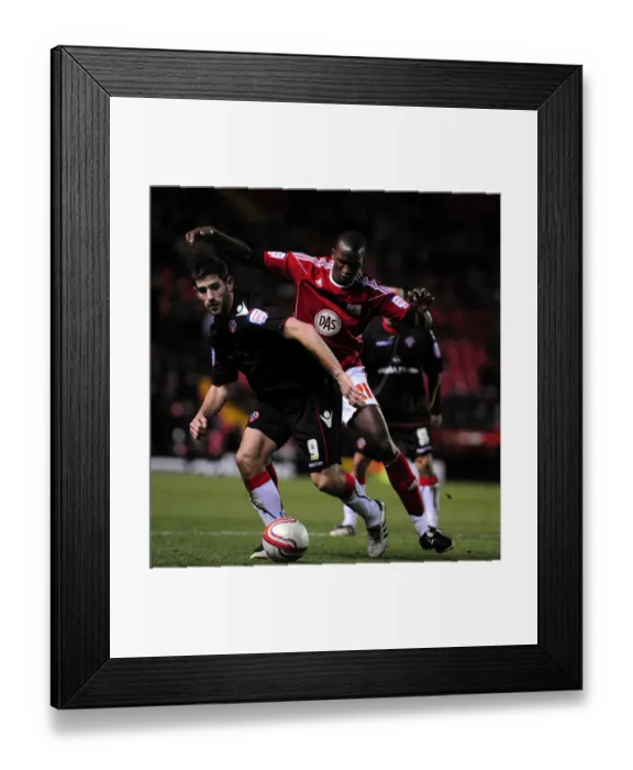 Framed Print : Battling for Supremacy: Cisse vs. Evans in the Championship Clash between Bristol City and Sheffield United (November 2010) Framed Print : Battling for Supremacy: Cisse vs. Evans in the Championship Clash between Bristol City and Sheffield United (November 2010)