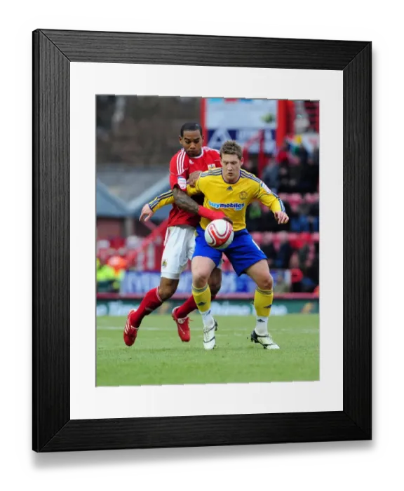 Framed Print : Battling for Supremacy: Marvin Elliott vs. Kris Commons in the Championship Clash between Bristol City and Derby County Framed Print : Battling for Supremacy: Marvin Elliott vs. Kris Commons in the Championship Clash between Bristol City and Derby County