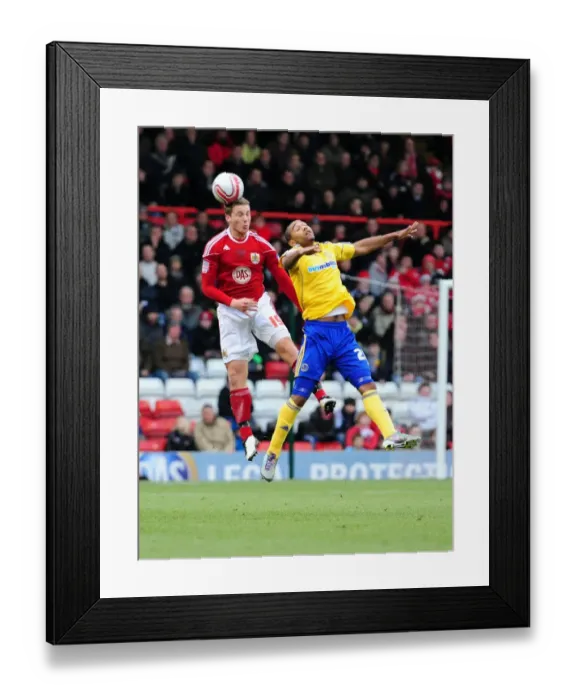 Framed Print : Bristol City's Christian Ribeiro Outmuscles Luke Moore in Championship Clash: Bristol City vs Derby County (11-12-2010) Framed Print : Bristol City's Christian Ribeiro Outmuscles Luke Moore in Championship Clash: Bristol City vs Derby County (11-12-2010)