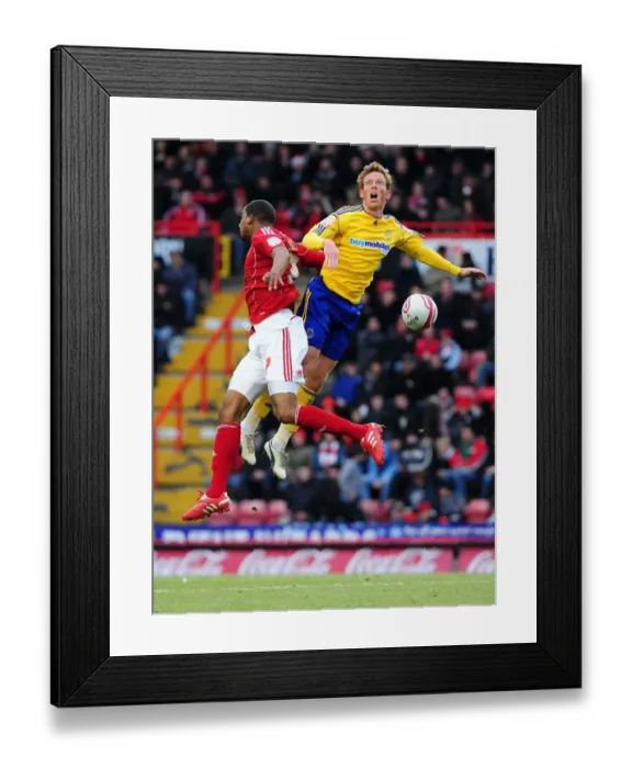 Framed Print : Bristol City vs Derby County: Marvin Elliott vs Paul Green - Championship Battle at Ashton Gate Stadium