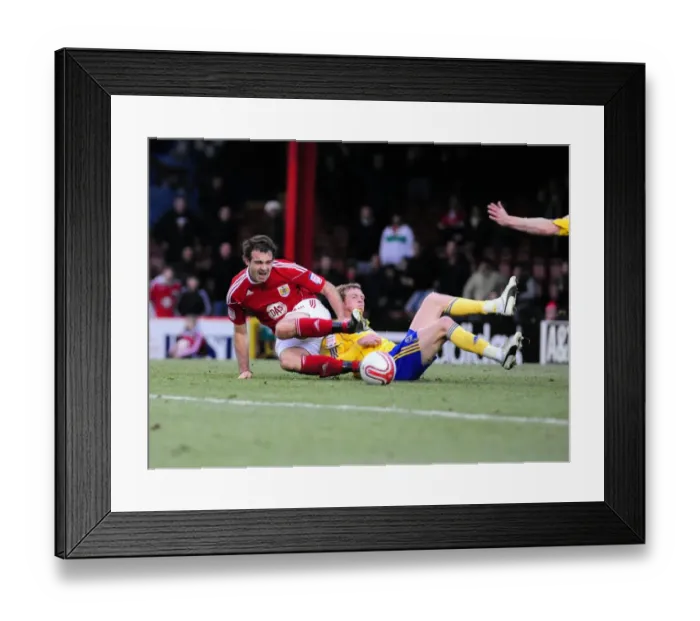 Framed Print : Bristol City's Brett Pitman Fouled by Derby County's Paul Green - Championship Clash, November 2010 Framed Print : Bristol City's Brett Pitman Fouled by Derby County's Paul Green - Championship Clash, November 2010