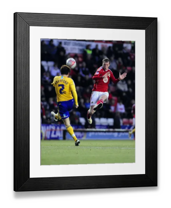 Framed Print : Battling for Supremacy: Clarkson vs. Brayford in the Championship Clash between Bristol City and Derby County