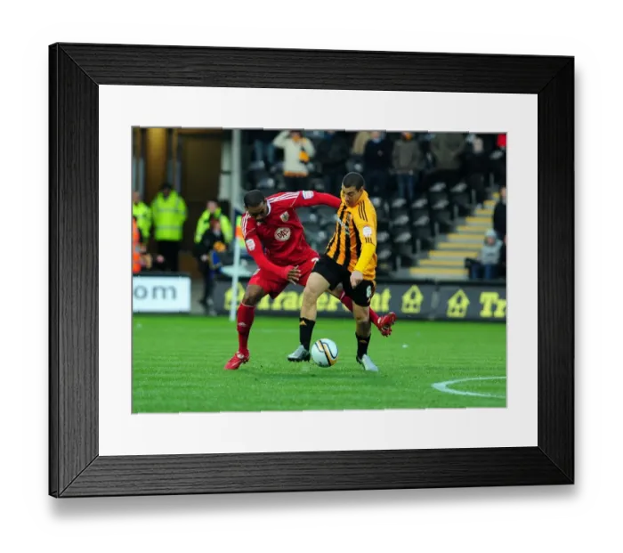 Framed Print : Battling for Supremacy: Marvin Elliott vs. James Harper in Hull City vs. Bristol City Championship Clash (18 / 12 / 2010)