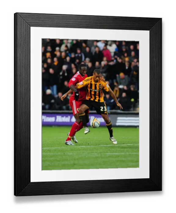 Framed Print : Battling for Supremacy: Damion Stewart vs. Jay Simpson in the 2010 Championship Clash between Hull City and Bristol City Framed Print : Battling for Supremacy: Damion Stewart vs. Jay Simpson in the 2010 Championship Clash between Hull City and Bristol City
