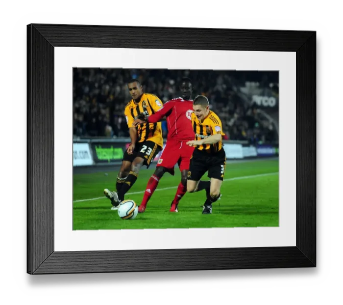 Framed Print : Adomah Slips Past Simpson and Dawson: Hull City vs. Bristol City Championship Clash (18 / 12 / 2010) Framed Print : Adomah Slips Past Simpson and Dawson: Hull City vs. Bristol City Championship Clash (18 / 12 / 2010)