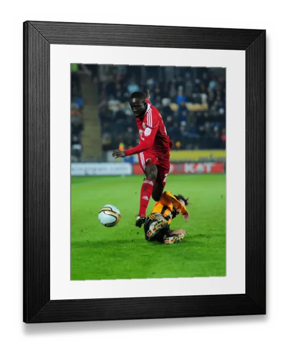 Framed Print : Avoiding the Tackle: Albert Adomah Evades Jamie Devitt in Championship Clash between Hull City and Bristol City (18 / 12 / 2010) Framed Print : Avoiding the Tackle: Albert Adomah Evades Jamie Devitt in Championship Clash between Hull City and Bristol City (18 / 12 / 2010)