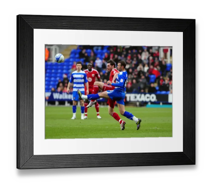 Framed Print : Battling for Supremacy: McAllister vs. Hunt in the 2010 Championship Clash between Reading and Bristol City