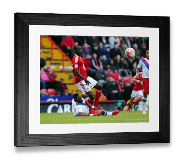 Framed Print : Bristol City's Albert Adomah Foul by Claude Davis in Championship Match at Ashton Gate Stadium (December 2010)