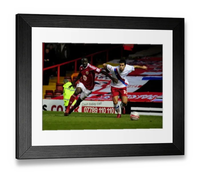 Framed Print : Adomah vs. Counago: Battle for the Ball in the Championship Clash between Bristol City and Crystal Palace (December 2010)
