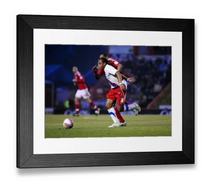 Framed Print : Battling Rivals: Marvin Elliott vs. Neil Danns - A Championship Showdown at Ashton Gate (December 2010)