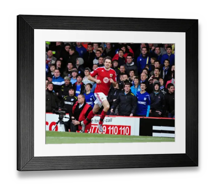 Framed Print : Brett Pitman's Euphoric Moment: Championship Clash between Bristol City and Cardiff City at Ashton Gate Stadium (01.01.2011)