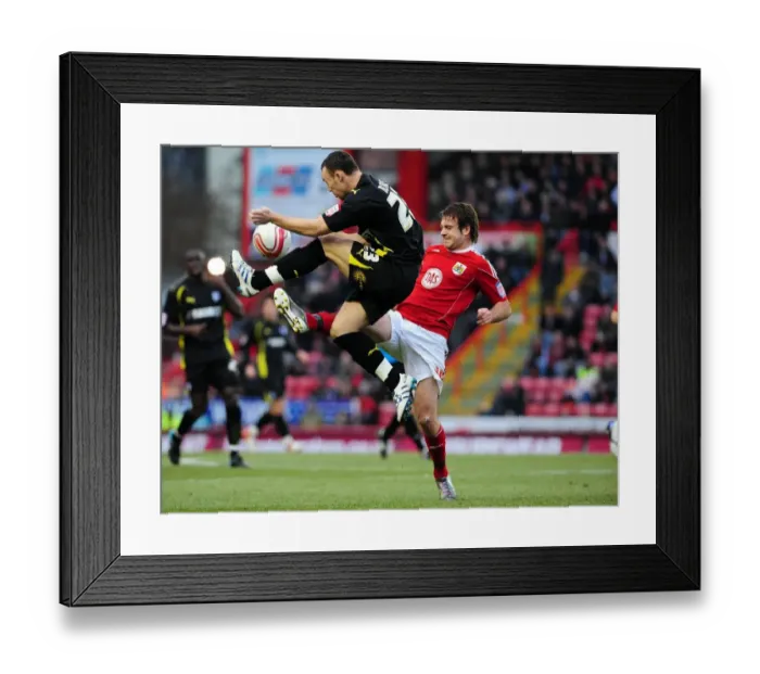 Framed Print : Battling for Supremacy: Brett Pitman vs. Darcy Blake - Bristol City vs. Cardiff City, Championship Clash at Ashton Gate Stadium (January 1, 2011)