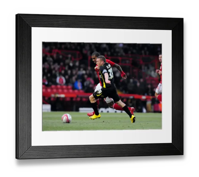 Framed Print : Battling for Supremacy: Craig Bellamy vs. Marvin Elliott in the 2011 Championship Clash between Bristol City and Cardiff City