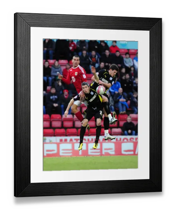Framed Print : Bristol City vs. Cardiff City: Intense Battle for the Ball - Steven Caulker vs. Kevin McNaughton and Mark Hudson (Championship Football Match, 01 / 01 / 2011, Ashton Gate Stadium) Framed Print : Bristol City vs. Cardiff City: Intense Battle for the Ball - Steven Caulker vs. Kevin McNaughton and Mark Hudson (Championship Football Match, 01 / 01 / 2011, Ashton Gate Stadium)