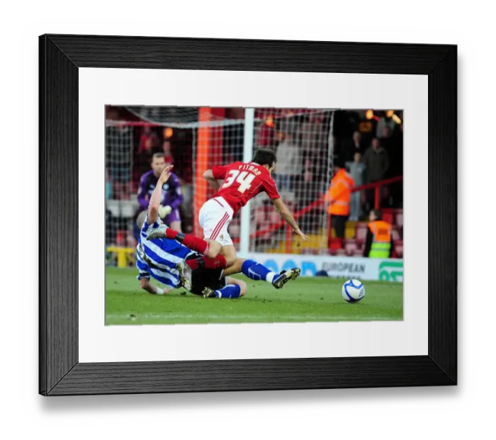 Framed Print : Bristol City's Brett Pitman Foul by Darren Purse in FA Cup Match vs Sheffield Wednesday Framed Print : Bristol City's Brett Pitman Foul by Darren Purse in FA Cup Match vs Sheffield Wednesday