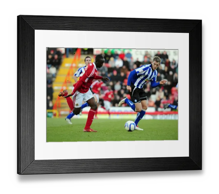 Framed Print : Adomah vs Jones: Intense Battle for the Ball in FA Cup Match between Bristol City and Sheffield Wednesday