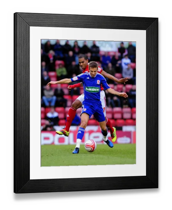 Framed Print : Battling for Supremacy: Marvin Elliott vs. Gary O'Neil in the Bristol City vs. Middlesbrough Championship Clash, January 2011