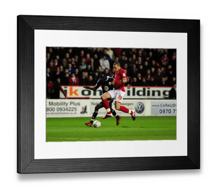 Framed Print : Adomah vs. Lynch: Intense Battle for Ball Possession during Forest vs. Bristol City Championship Clash, January 2011 Framed Print : Adomah vs. Lynch: Intense Battle for Ball Possession during Forest vs. Bristol City Championship Clash, January 2011