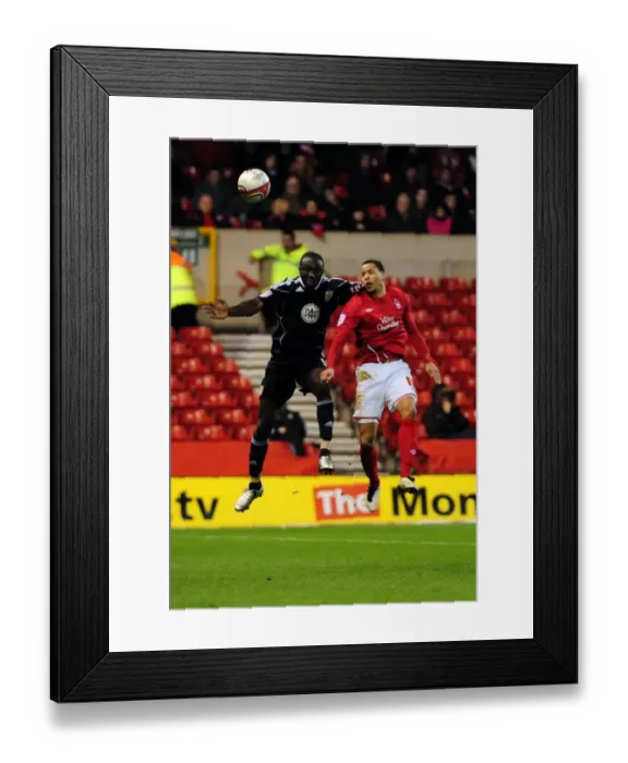 Framed Print : Battling for Supremacy: Damion Stewart vs. David McGoldrick in Forest v Bristol City Football Match, 2011