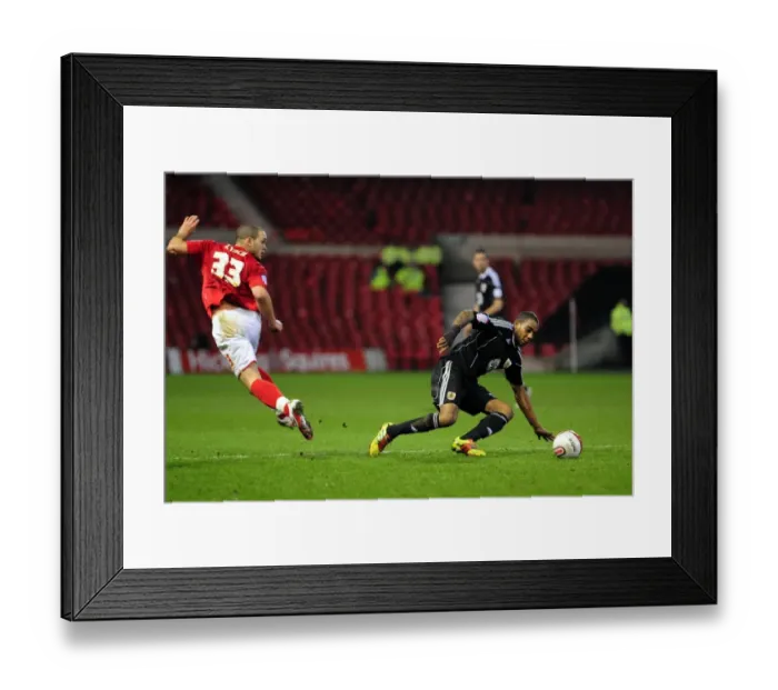 Framed Print : Marvin Elliott Tackles Joel Lynch in Intense Forest vs. Bristol City Championship Clash