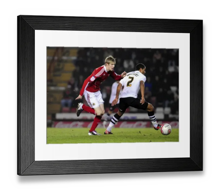 Framed Print : Andy Keogh Darts Past Ashley Williams: A Pivotal Moment in the 2011 Championship Clash Between Bristol City and Swansea City