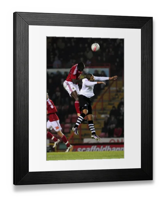 Framed Print : Battling for Supremacy: Damion Stewart vs Luke Moore in the Championship Clash between Bristol City and Swansea City (01 / 02 / 2011) Framed Print : Battling for Supremacy: Damion Stewart vs Luke Moore in the Championship Clash between Bristol City and Swansea City (01 / 02 / 2011)