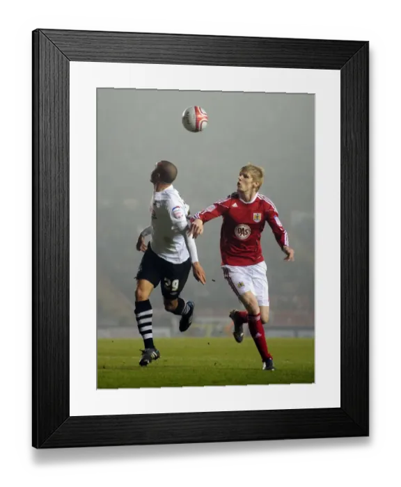 Framed Print : Intense Rivalry: Keogh vs. Richards Clash in Bristol City vs. Swansea City Championship Showdown, January 2011