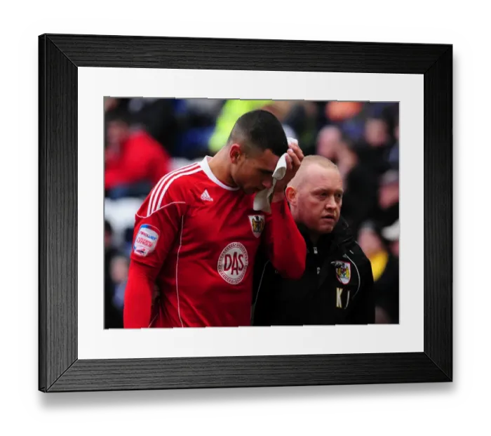 Framed Print : Bristol City's Steven Caulker Sustains Head Injury During Preston North End Match
