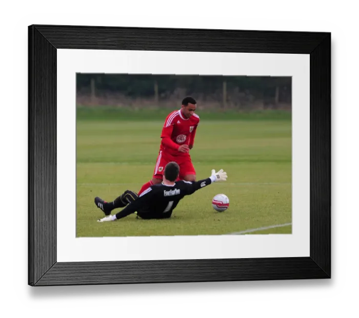 Framed Print : Bristol Citys Nicky Maynard rounds the Swindon Keeper but sees his shot cleared of the line Framed Print : Bristol Citys Nicky Maynard rounds the Swindon Keeper but sees his shot cleared of the line