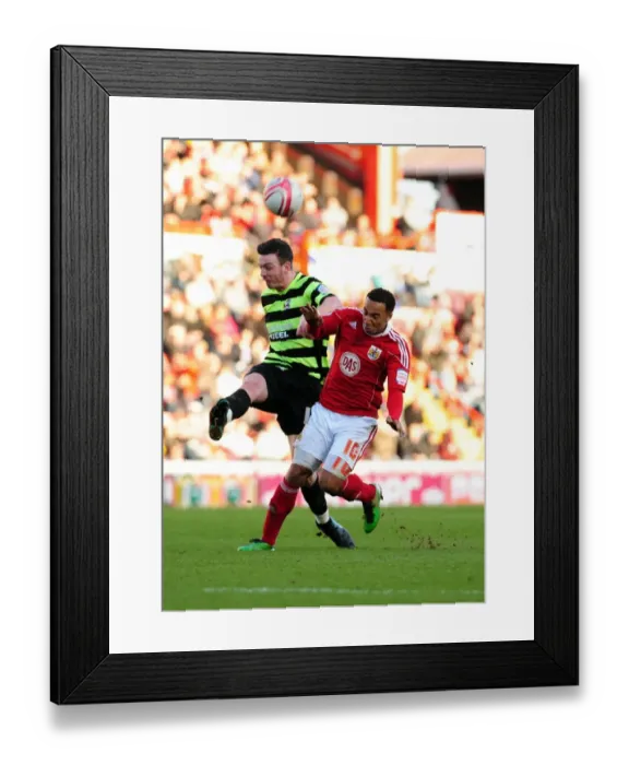 Framed Print : Battling for Supremacy: Nicky Maynard vs. Michael Raynes in the 2010 Championship Clash between Bristol City and Scunthorpe United