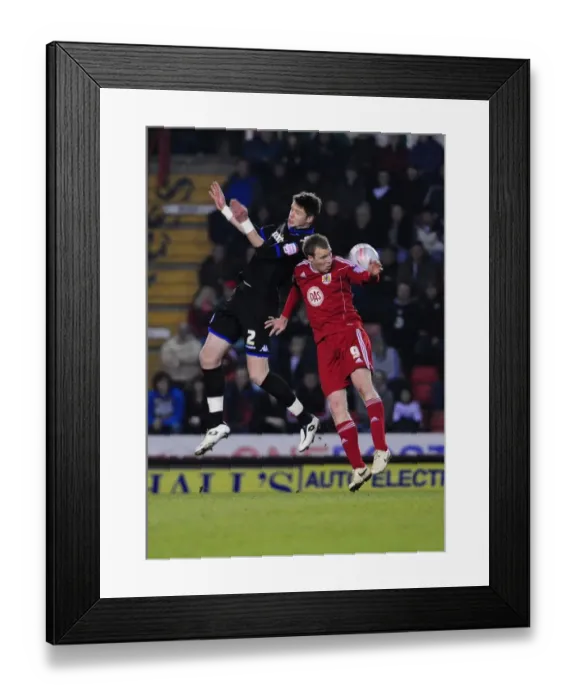 Framed Print : Clash at Ashton Gate: David Clarkson vs. Greg Halford in Intense Aerial Battle during Bristol City vs. Portsmouth Championship Match, March 2011 Framed Print : Clash at Ashton Gate: David Clarkson vs. Greg Halford in Intense Aerial Battle during Bristol City vs. Portsmouth Championship Match, March 2011