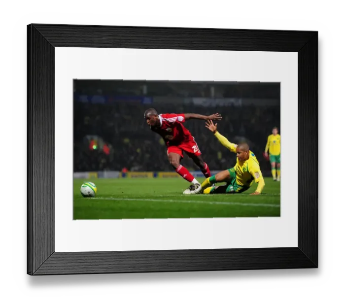 Framed Print : Battling for the Ball: Cisse vs. Jackson in Intense Norwich City vs. Bristol City Championship Clash, March 14, 2011