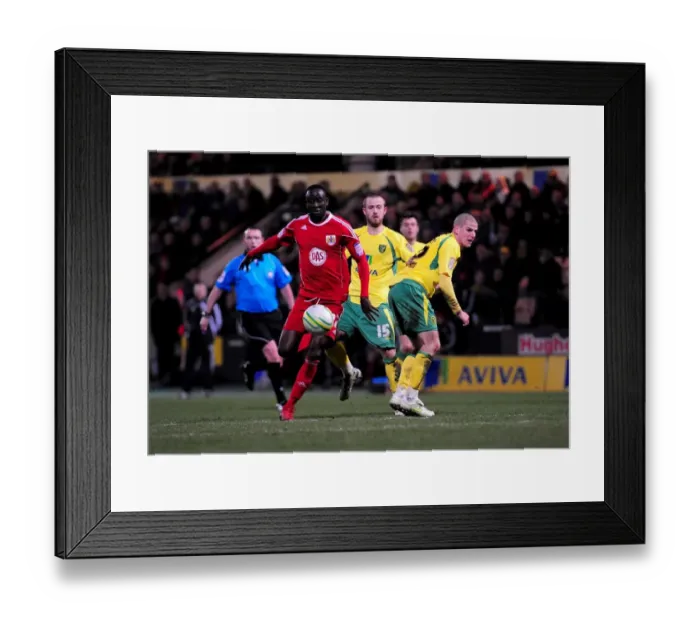 Framed Print : Adomah Outmaneuvers Tierney: Norwich City vs. Bristol City Championship Clash (14-03-2011) Framed Print : Adomah Outmaneuvers Tierney: Norwich City vs. Bristol City Championship Clash (14-03-2011)