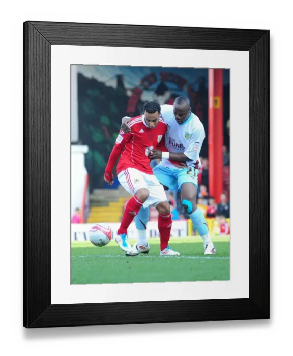 Framed Print : Bristol City vs Burnley: Intense Battle Between Nicky Maynard and Andre Bikey in the 2011 Championship Match Framed Print : Bristol City vs Burnley: Intense Battle Between Nicky Maynard and Andre Bikey in the 2011 Championship Match