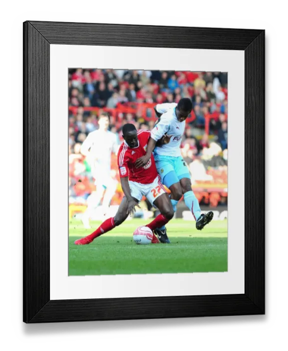 Framed Print : Adomah vs Bartley: Intense Battle for Control in the 2011 Championship Clash between Bristol City and Burnley Framed Print : Adomah vs Bartley: Intense Battle for Control in the 2011 Championship Clash between Bristol City and Burnley