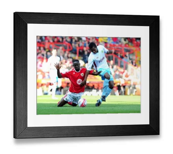 Framed Print : Adomah vs Bartley: Battle for Supremacy in the Championship Clash between Bristol City and Burnley (19-03-2011)