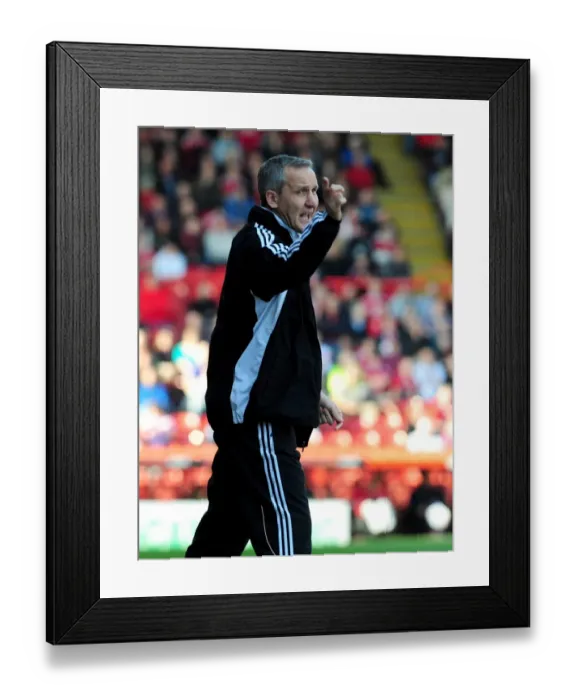 Framed Print : Keith Miljen Leads the Charge: Championship Showdown between Bristol City and Burnley at Ashton Gate Stadium, 19-3-2011