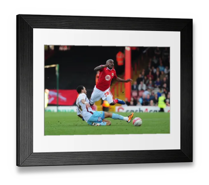 Framed Print : Bristol City's Kalifa Cisse Fouled by Burnley's Tyrone Mears in Championship Match, 2011 Framed Print : Bristol City's Kalifa Cisse Fouled by Burnley's Tyrone Mears in Championship Match, 2011