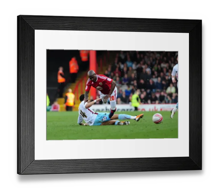 Framed Print : Bristol City's Kalifa Cisse Foul by Tyrone Mears during Championship Match, March 19, 2011