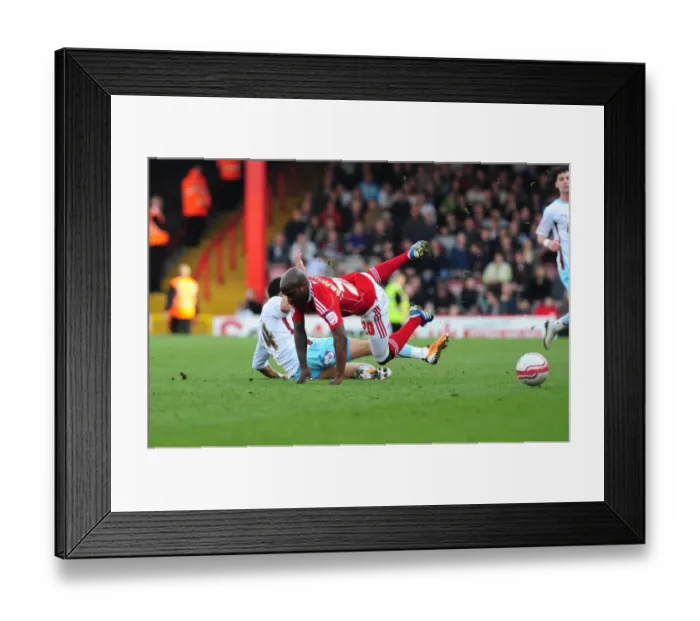 Framed Print : Bristol City's Kalifa Cisse Fouled by Tyrone Mears in Championship Match (2011)