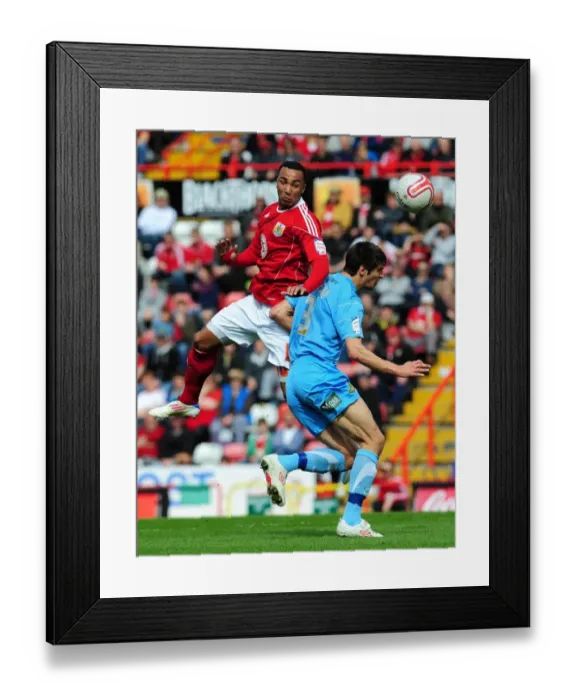 Framed Print : Intense Rivalry: Maynard vs. Friend in the Championship Clash between Bristol City and Doncaster Rovers, April 2011