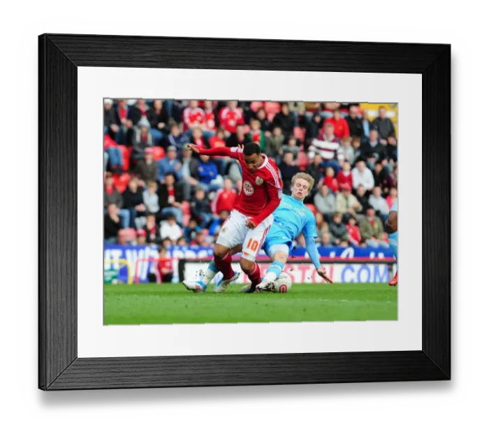 Framed Print : Bristol City's Nicky Maynard vs. Joseph Mills Tackle: Championship Clash Between Bristol City and Doncaster Rovers (02 / 04 / 2011)