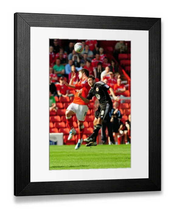 Framed Print : Battling for Supremacy: Johnson vs. Butterfield in the Championship Clash between Barnsley and Bristol City (09 / 04 / 2011) Framed Print : Battling for Supremacy: Johnson vs. Butterfield in the Championship Clash between Barnsley and Bristol City (09 / 04 / 2011)