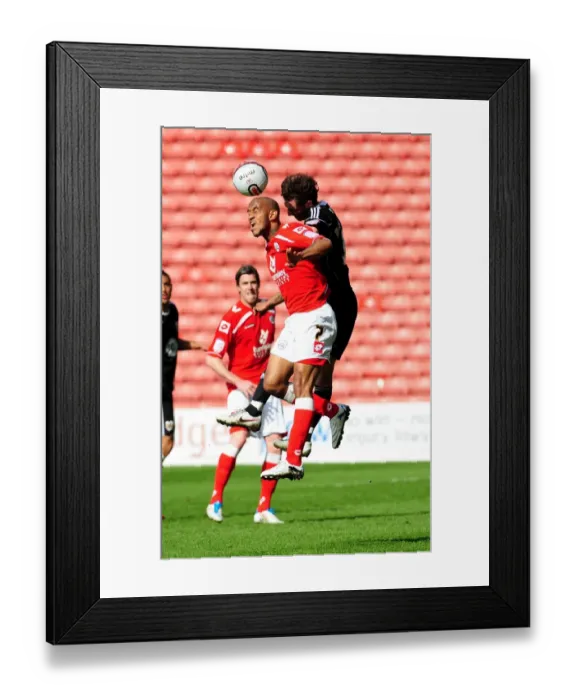 Framed Print : Battling for Supremacy: Haynes vs. McAllister in the Championship Clash between Barnsley and Bristol City (09 / 04 / 2011)